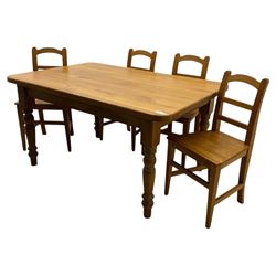 Contemporary light oak farmhouse dining table, and four oak ladder back dining chairs, rectangular top with rounded corners, raised on four turned baluster legs in natural lacquered finish, chairs with three horizontal slats beneath a shaped top rail, solid seat and square section legs united by stretchers
