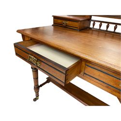 Late Victorian Aesthetic Movement walnut and inlaid ebony dressing table, swing mirror back with shell carving and spindle support rail, fitted with two trinket drawers and single frieze drawer, raised on ring turned supports with castors