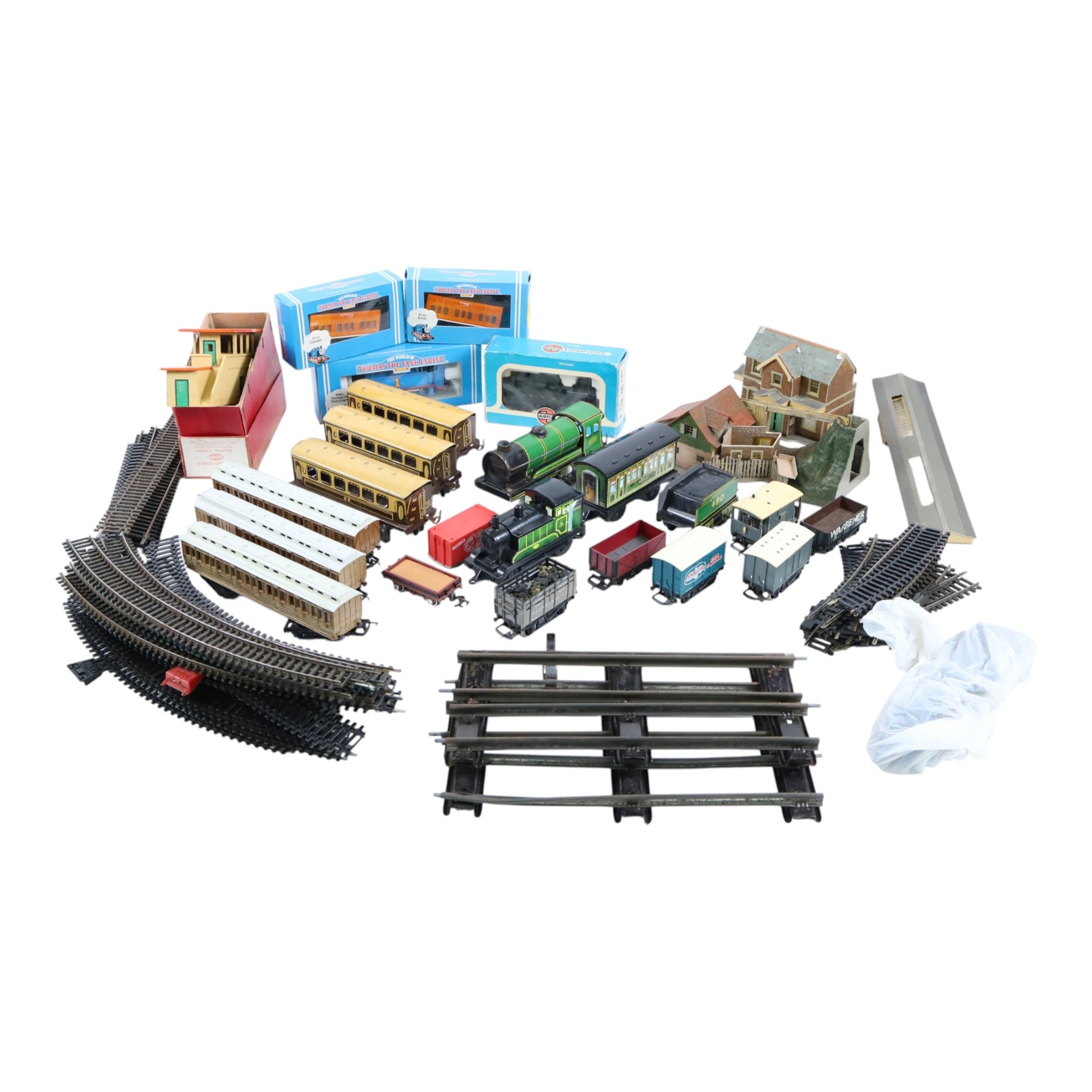 Collection of model railway locomotives, track and accessories, including Mettoy tin plate clockwork 0 gauge locomotive, tender and three coaches, boxed Hornby 00 gauge Thomas the Tank engine locomotive and two wagons, loose 00 gauge rolling stock and track and some kit built buldings, etc
