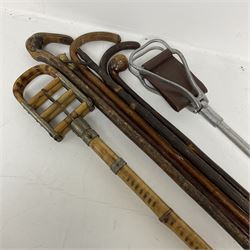 Early 20th century bamboo & metal French shooting stick, the mount stamped Bte. SGDG, together with other various walking sticks and canes