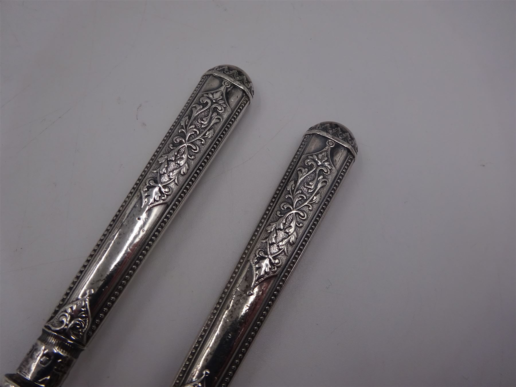 1930s silver open sucrier, of circular form with girdle, with shaped rim and upon three pad feet, hallmarked Birmingham 1931, together with silver fork and spoon set, decorated in relief with foliate pattern to handles, hallmarked William Devenport, Birmingham 1896 to blades and Sheffield 1896 handles