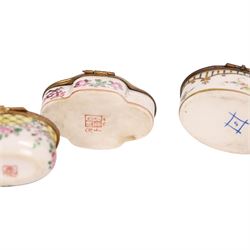Four 19th century and later pill boxes, each decorated to the lid with floral sprigs, H3cm