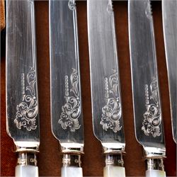 Set of twelve dessert knives and forks with engraved plated blades, silver collars and mother of pearl handles by Walker & Hall in oak box Sheffield 1927 and a set of twelve plated fish knives and forks with servers, boxed
