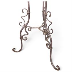 Three wrought iron garden basket planters, comprising a circular pierced and scrolling basket on tall tripod stand with scrolling supports (W31cm H76cm), and a pair of matching hanging baskets (W37cm H30cm)