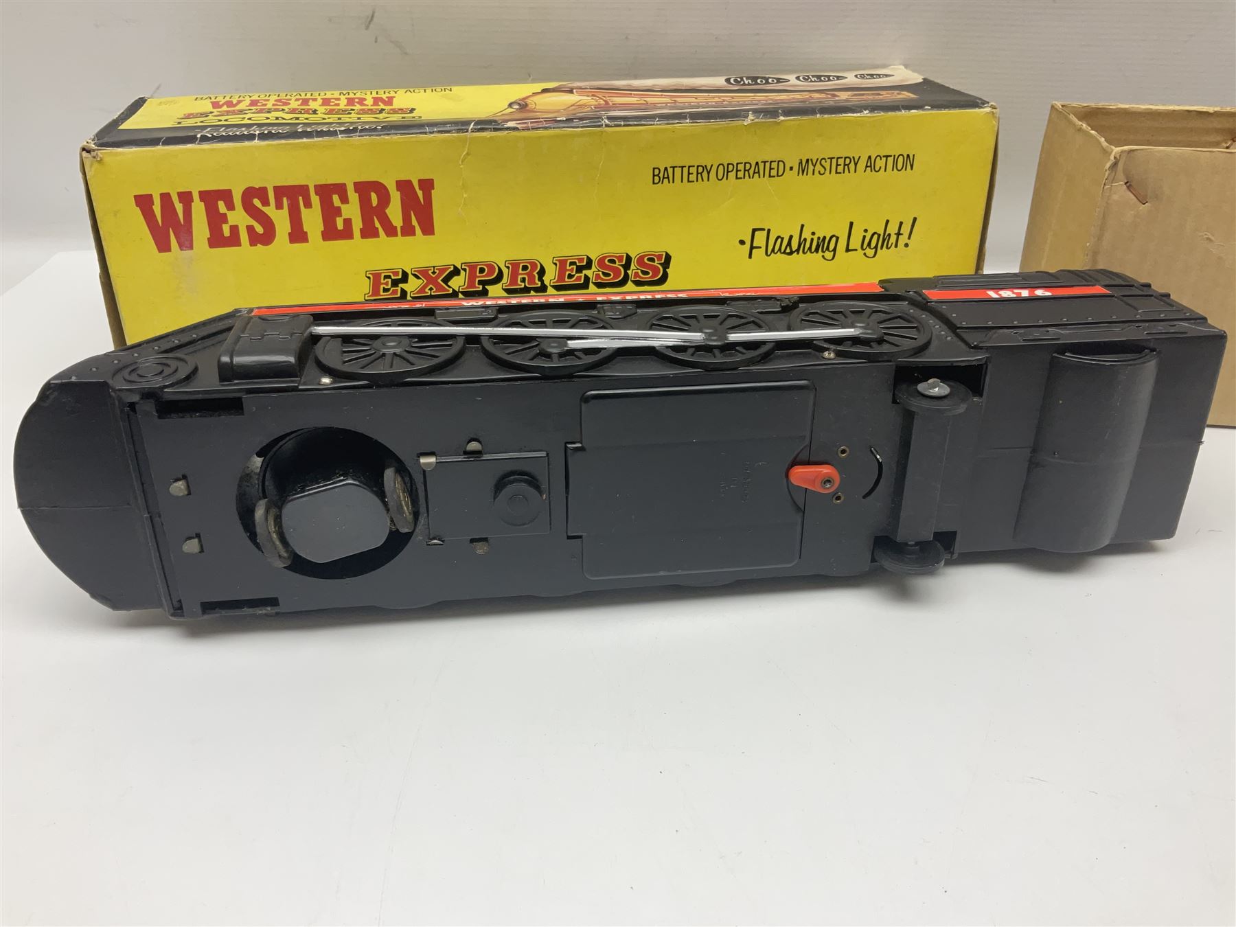 Mickey Mouse Trick Star battery operated drummer figure; Illco Mickey Mouse battery operated Fun Castle Roller Coaster; battery operated Western Express Locomotive; and JK Wells Fargo Overland Stage scale model; all boxed (4)