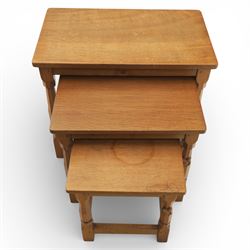 Squirrelman - nest of three tables, each with rectangular top upon octagonal turned supports with squirrel carving, by Wilfrid Hutchinson, Husthwaite