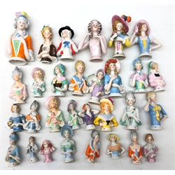  Collection of thirty ceramic pin cushion/ half dolls of varying size H12cm max  