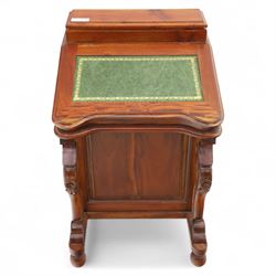 Victorian design mahogany Davenport desk, the sloped writing surface inset with tooled green leather and hinged to reveal a fitted interior, with a pen compartment to the raised gallery back, four drawers to each side, on carved scrolled supports with acanthus detail, raised on turned feet