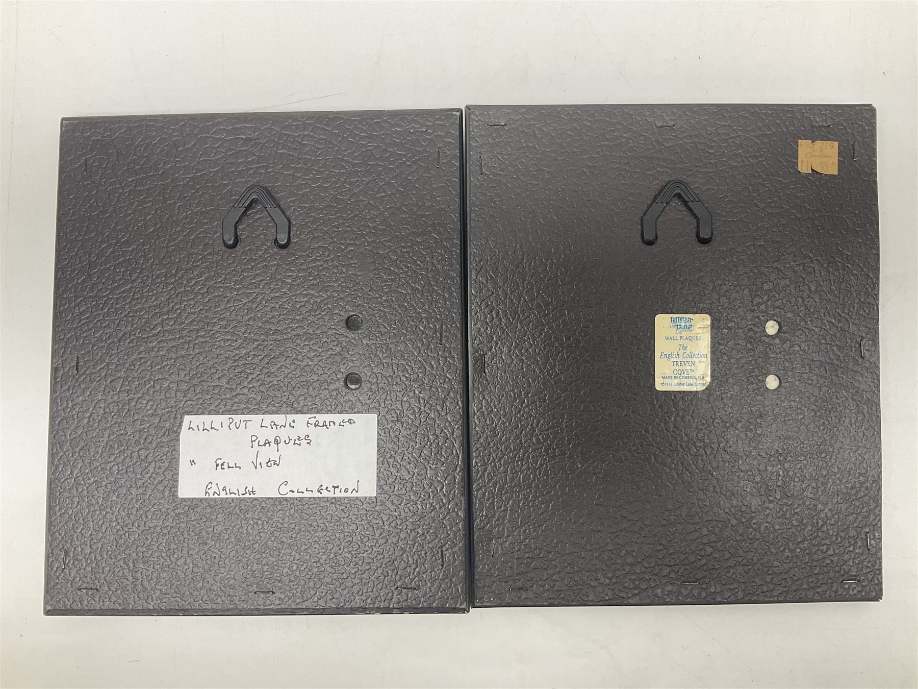 Nine Lilliput Lane framed wall plaques, including Fell View, Battleview, Catslide Cottage, Ashdown Hall and Shannon's Bank, together with three smaller circular framed Lilliput Lane plaques