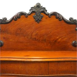 Victorian mahogany chiffonier, raised back with applied carvings, above a serpentine fronted base, a single frieze drawer, above a cupboard with shelf and drawer with campaign handle, raised on a plinth base
