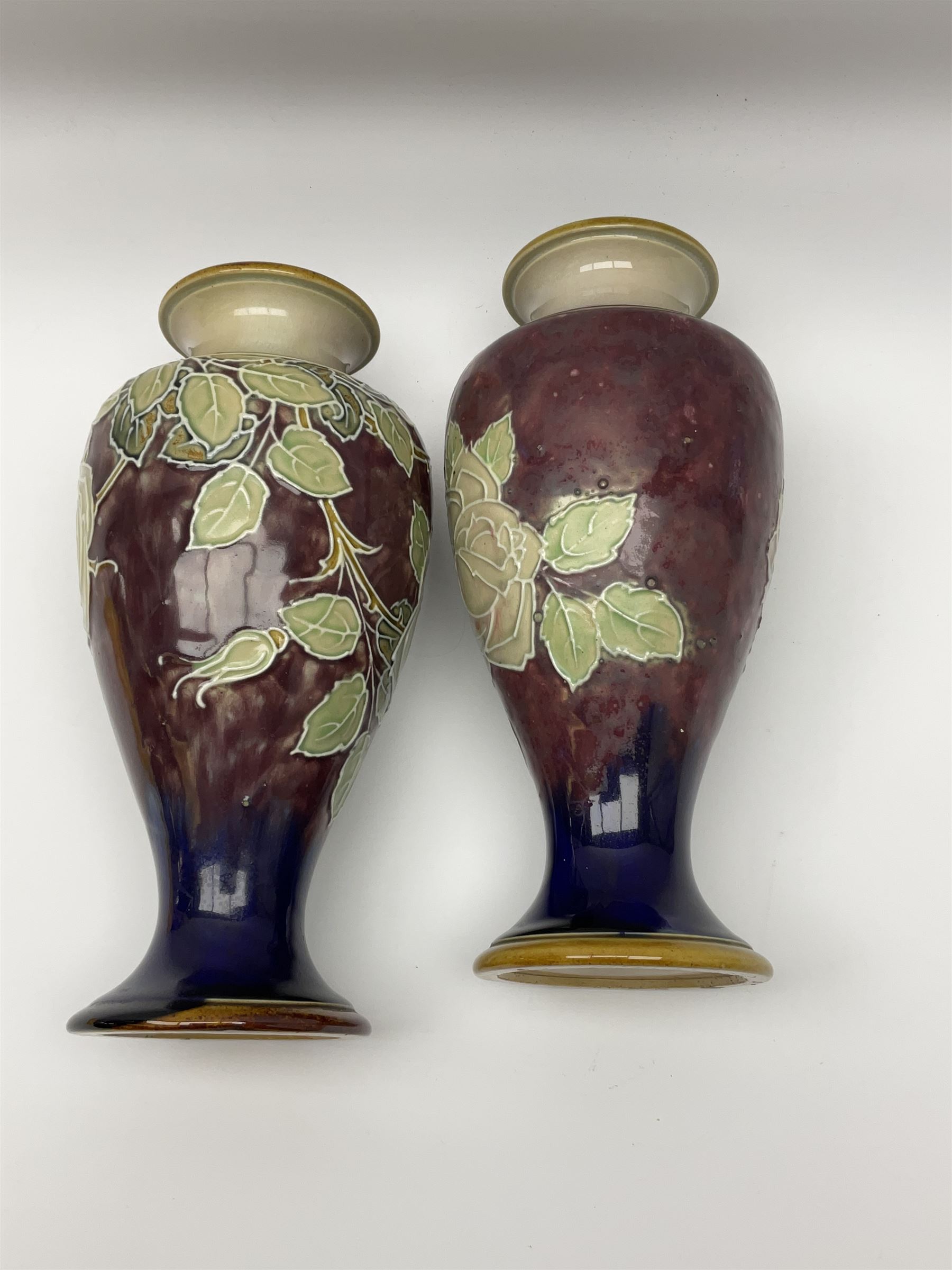 A pair of early 20th century Royal Doulton stoneware vases, of baluster