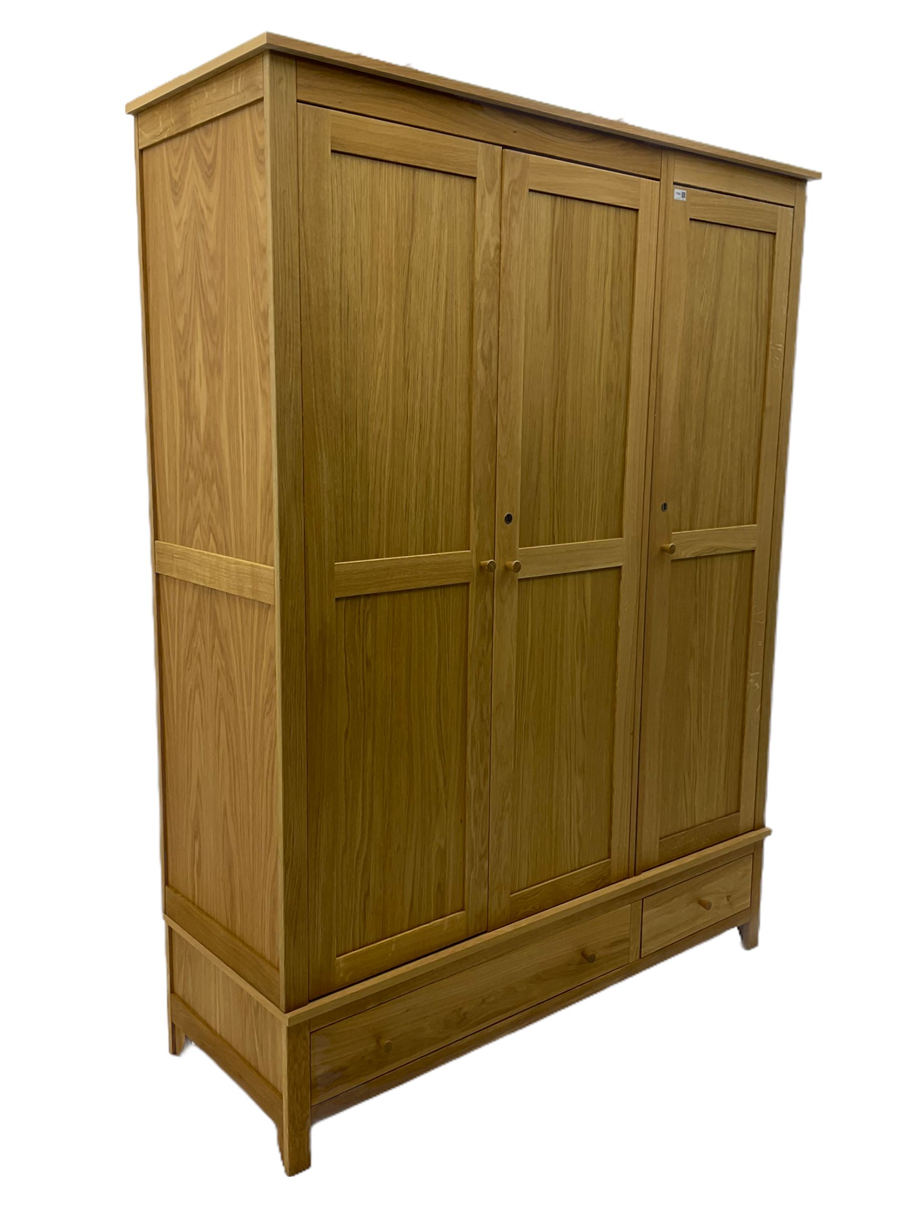 Corndell Furniture - light oak triple wardrobe, enclosed by three panelled doors, one long and one short drawer