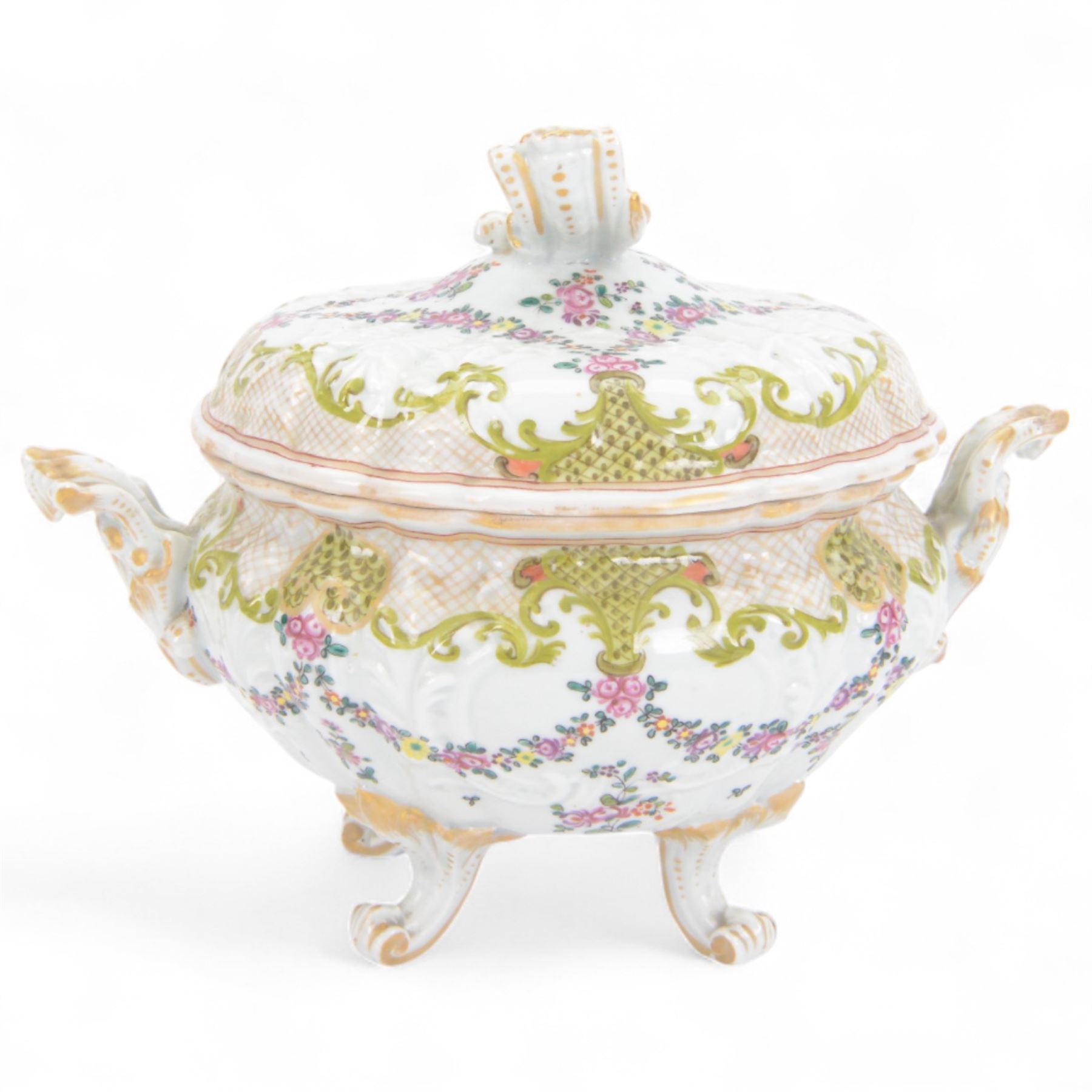 19th Century French faience tureen and cover, decorated with floral swag and net detail with gilt scrollwork handles, raised on four scroll feet, H20cm