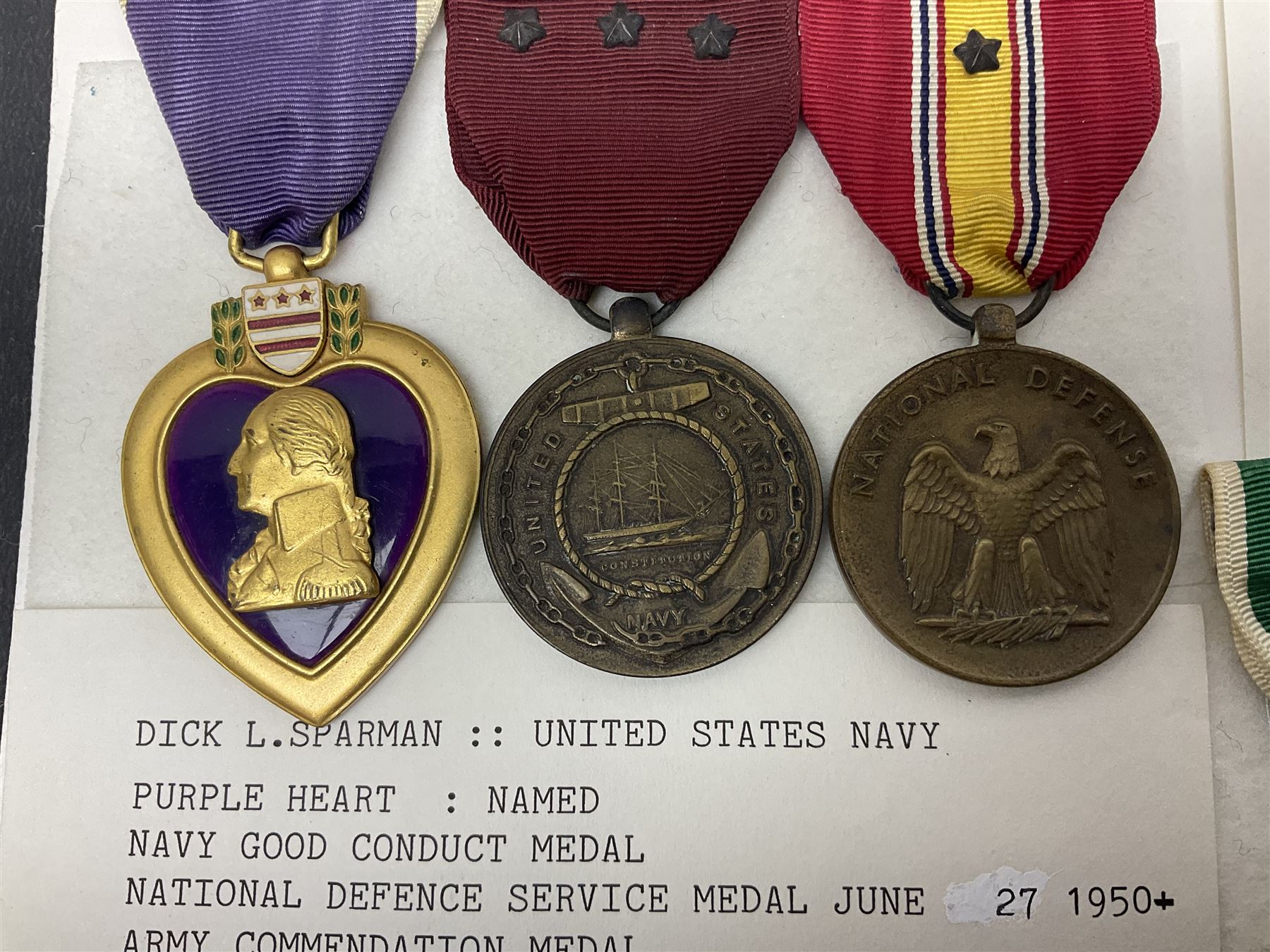 Nine American medals comprising Legion of Merit, Distinguished Flying Cross, Purple Heart named to Dick L. Sparman, Navy Good Conduct Medal, National Defence Service Medal, Army Commendation Medal, two WWII Victory Medals and China Medal; all with ribbons (9)