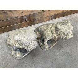 Pair of cast stone garden British bulldogs, on shaped plinths
