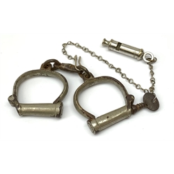 Pair of 1920's Hiatt nickel plated handcuffs marked 'Warranted Wrought' with screw-in key and a 'Metropolitan' whistle