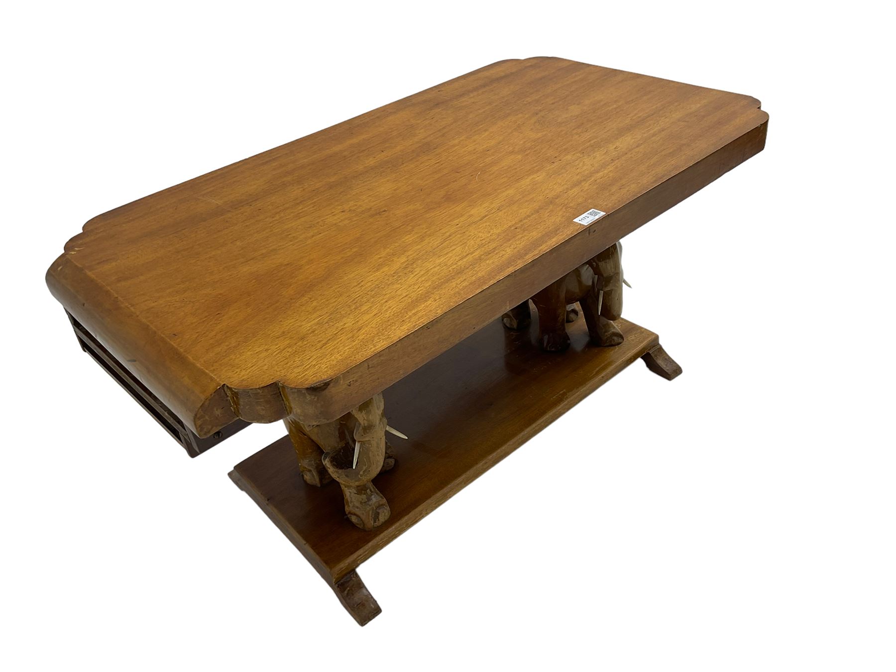 Hardwood coffee table on carved elephant figure supports, platform base on sledge feet