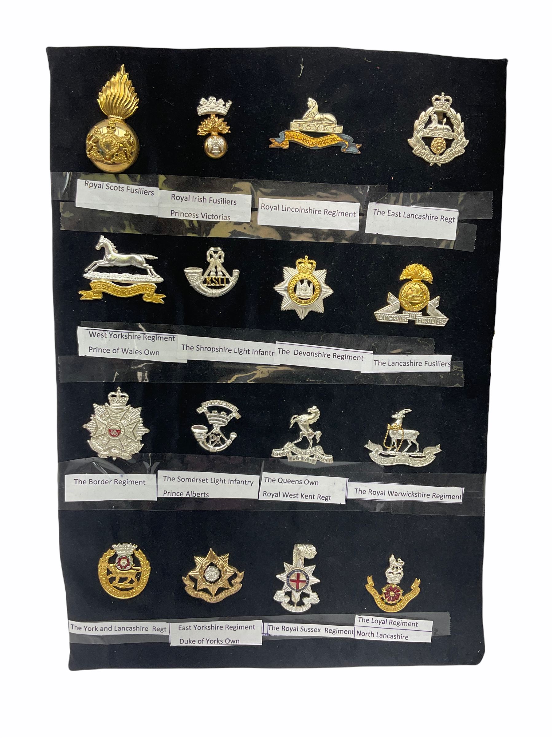 Collection of thirty-two reproduction military badges, including Royal Scots Fusiliers, Royal Lincolnshire Regiment, The Boarders Regiment etc. 