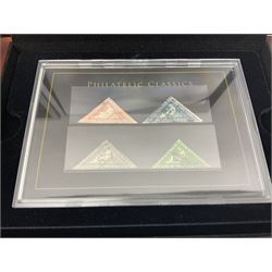 Set of four Cape of Good Hope triangles comprising one penny, four pence, six pence and one shilling and a set of Queen Victoria six pence colours and plates, both sets housed in display boxes with Westminster certificates