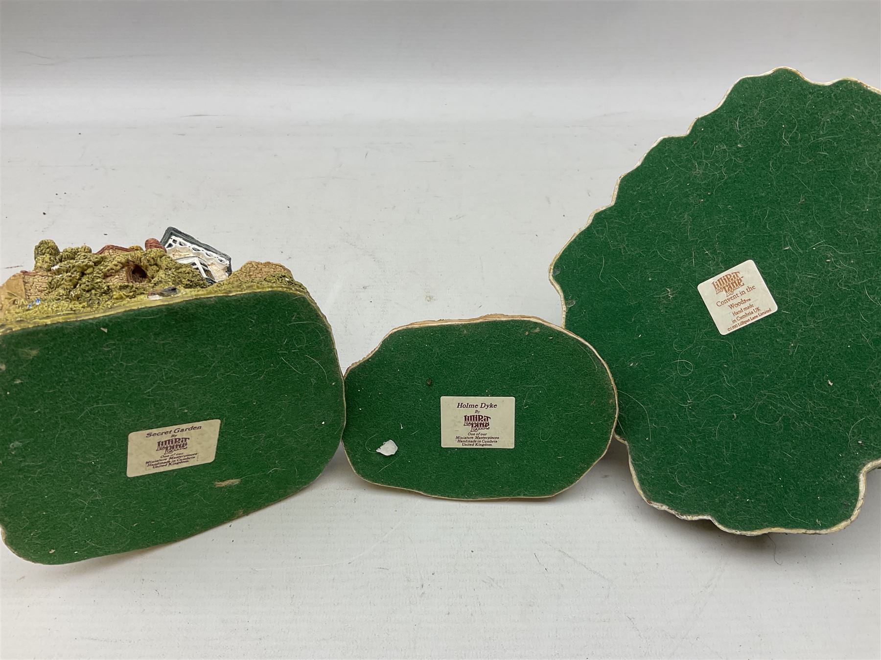 Forty six Lilliput Lane model cottages, to include 'Convent in the Woods', 'Holme Dyke' 'Secret Garden' etc