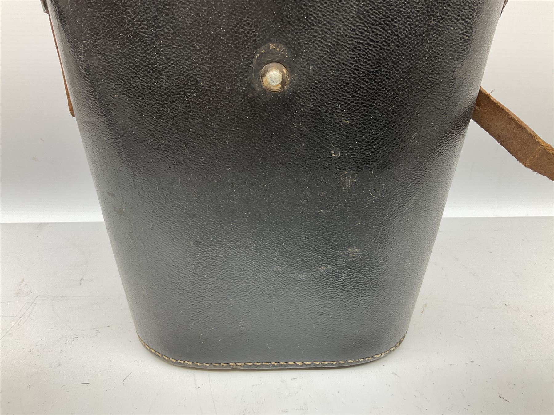 Pair of WWII German U-boat binoculars probably 7 x 50 by Leitz, with rubber eye piece protector covers and leather case stamped with Kriegsmarine mark to the lid and dated 1944, with leather strap.