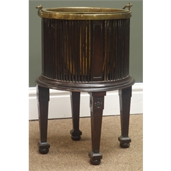  George lll style mahogany Oyster Pail, cylindrical stick body with brass liner and swing handle, on fluted square supports with bun feet, D30cm x H43cm  