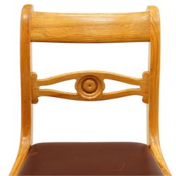 Seahorseman by Shaw & Riley - set of four Yorkshire oak bar-back dining chairs, brown vinyl drop in seat, raised on shaped supports with signature Seahorse carving from the workshop of A. Shaw & Riley Ltd, Hessay