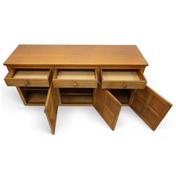 Beaverman - 1980s adzed oak sideboard raised on a trestle base, three drawers over three cupboards with Yorkshire Rose carved handles, fielded panelled sides and front, with carved Beaver, by Colin Almack of Sutton near Thirsk