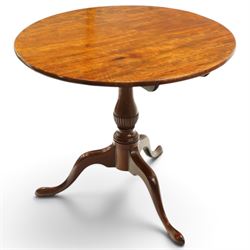 George III mahogany tilt-top tripod table, the circular figured top raised on a turned and...