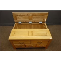  Light oak coffee table chest with half hinged top, three short and two long drawers, stile supports, W92cm, H50cm, D60cm  
