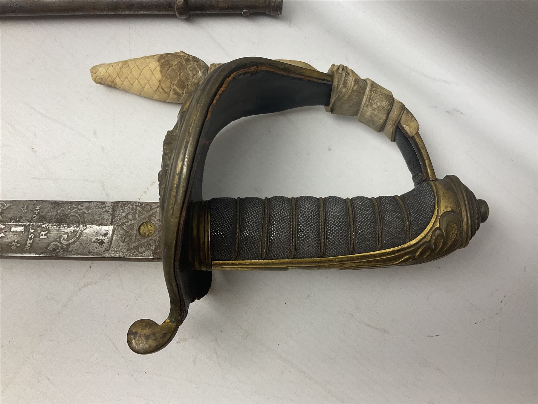 Victorian British Army officer's sword by Hobson & Sons Little Windmill Street London, the 82cm fullered steel blade etched with crowned Victoria cypher and 'HM 1st West York R.V.', lined gilded brass three-bar hilt incorporating Victoria cypher and wire-bound fish skin grip with plaited knot; in steel scabbard with two hanging rings L99cm overall