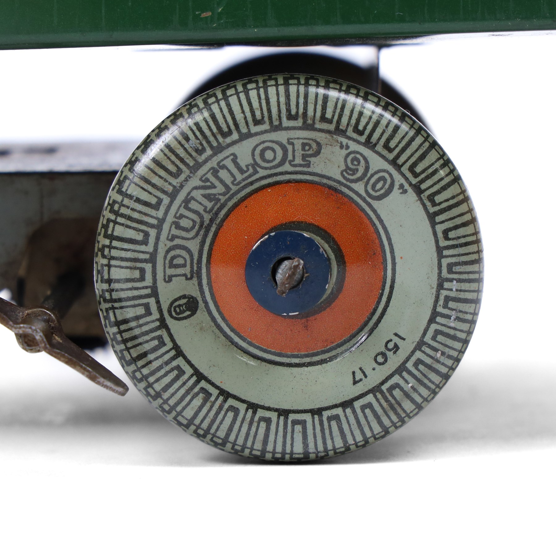 Mettoy tin plate clockwork Dunlop 90 tipper truck, in green and cream livery, H10cm, L28cm