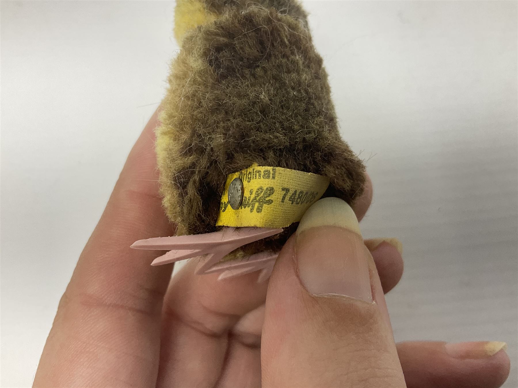 Group of Steiff figures, comprising Mikki and Mukki, circa 1950s no 7628/12 and 7627/12, with original tags, two hedgehogs no 1570/10, and another smaller 1670/03, small owl no 7480/06, and painted metal Steiff harlequin style bear