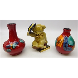  Two Poole Pottery Volcano pattern vases, H16.5cm max and Wade Library Bear 1988 (3)  