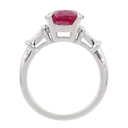 18ct white gold ruby and diamond ring, the oval cut ruby of 4.16 carat, with two tapered baguette cut diamonds set either side, hallmarked