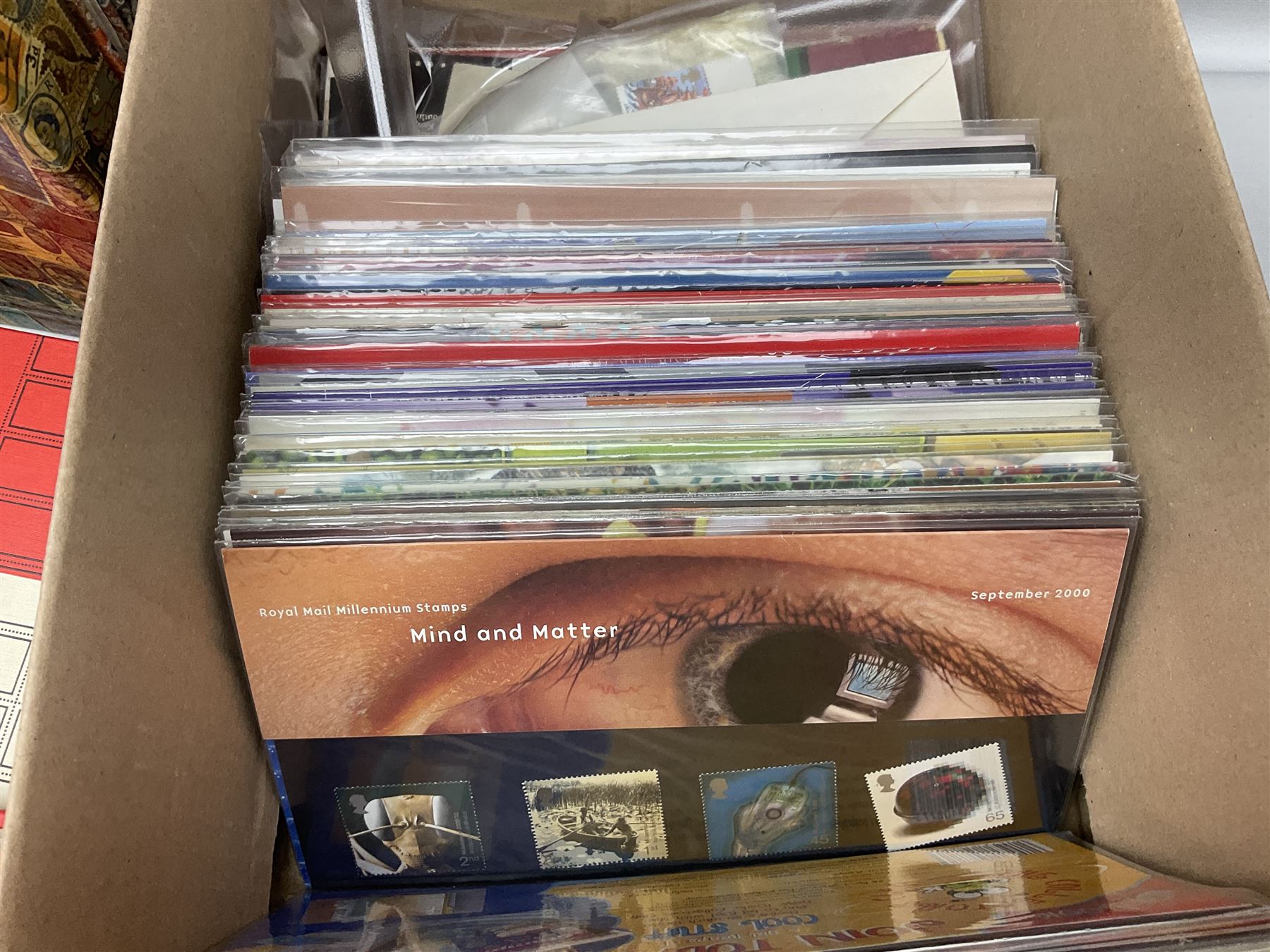 Royal Mail Queen Elizabeth II mint stamps in presentation packs, three part filled Stanley Gibbons 'Great Britain Special Stamps' albums, World stamps including Aden, Angola, Argentina, Australia etc, in various albums, in one box