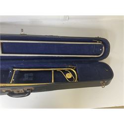 Three brass trombones comprising Elkhart Ind. USA 'CONN' model no.72H; Besson 'Concord'; and Selmer Distributed 'Lincoln'; two in carrying cases; and German B & M 'Champion' brass trumpet (4)
