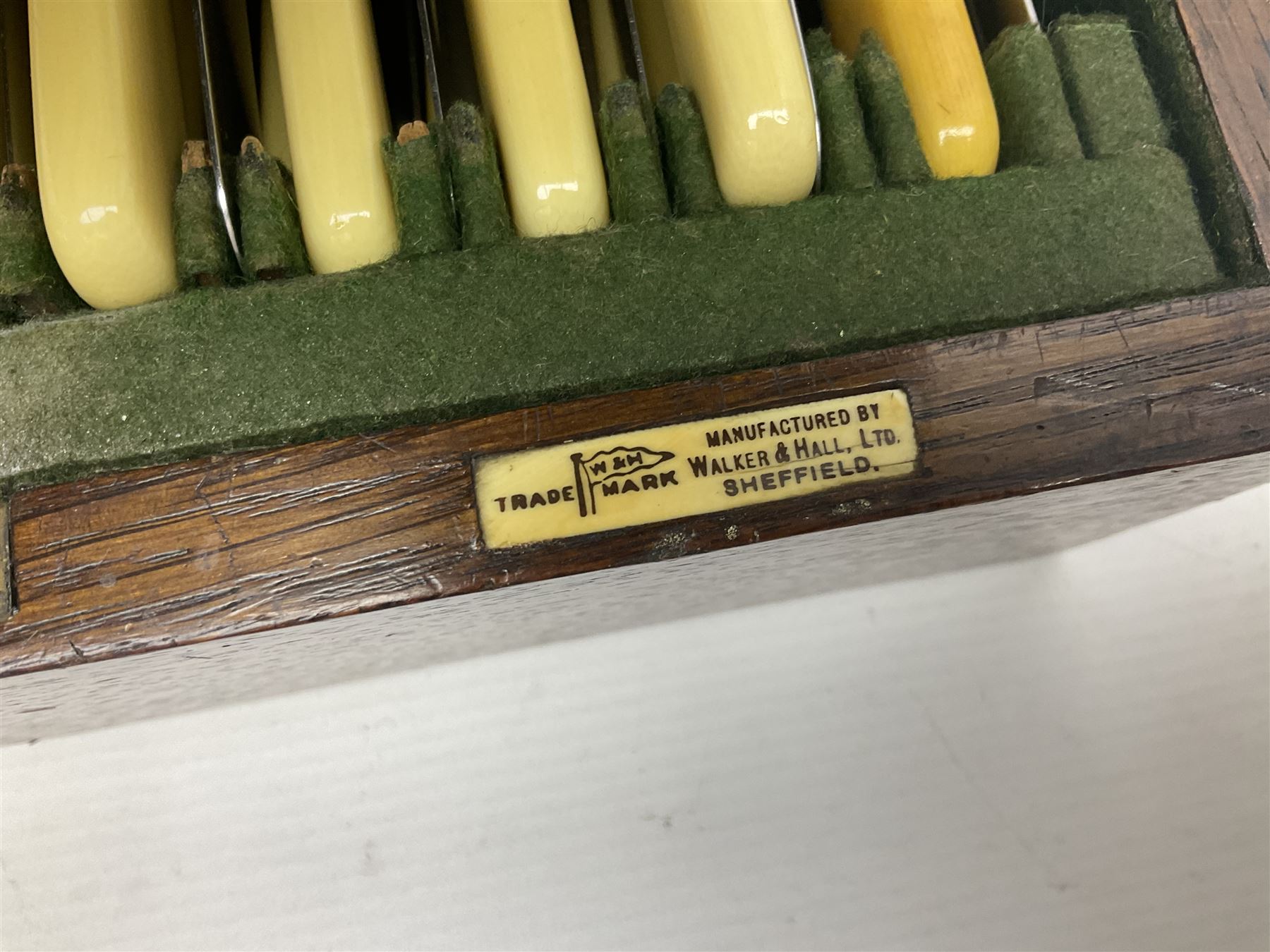 Walker and Hall silver plated canteen of cutlery, oak case, the hinged lid with a engraved brass shield , H12cm, L32cm