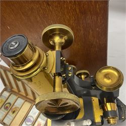 W. Watson & Sons Ltd lacquered brass compound microscope circa 1910, the back foot signed W. Watson & Sons Ltd, 313 High Holborn London and numbered 8193, together with a boxed collection of glass microscope biological sample slides