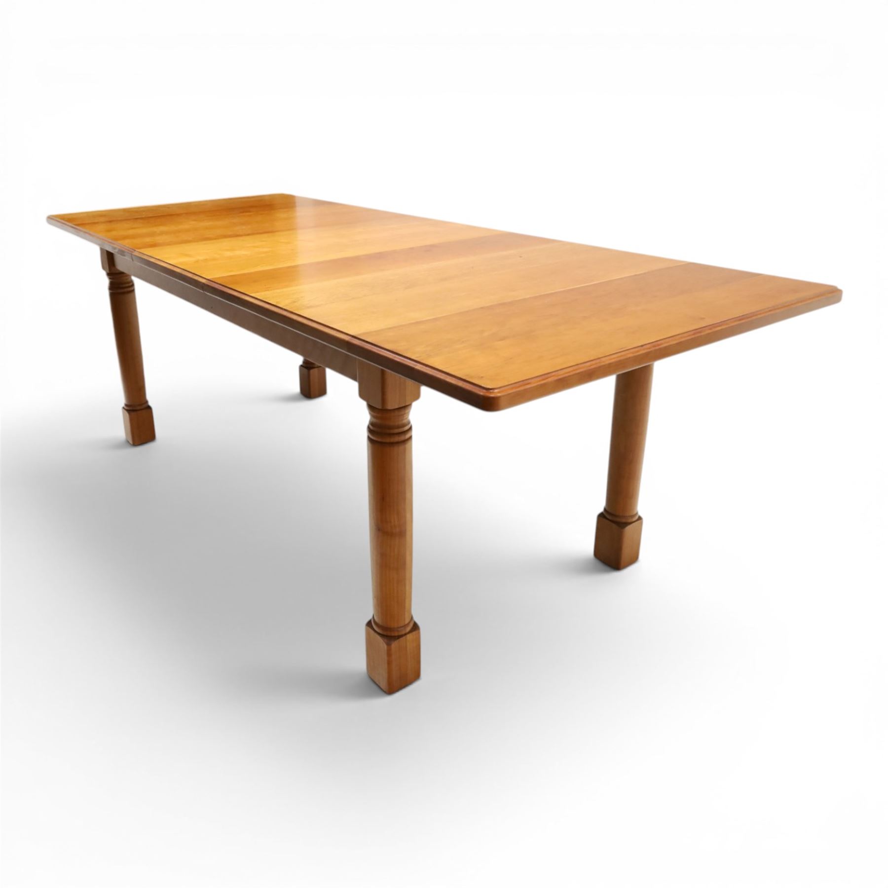 Knightman - cherrywood extending dining table, the rectangular top raised on four turned legs, with additional leaf extending to 230cm total, recessed carved knight trademark, by Horace Knight of Old Mill Furniture, Balk near Thirsk