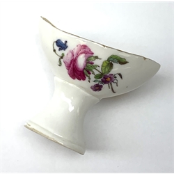 A Höchst eyebath c.1775, the oval bowl painted in polychrome enamels with floral sprays, blue wheel mark, H3.5cm.
