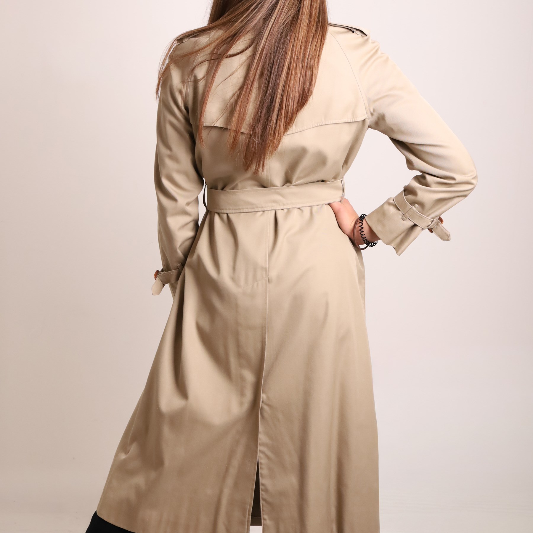 Burberrys and Aquascutum - two vintage trench coats, comprising a Burberrys red cotton trench coat with navy, red and grey check lining, labelled Burberrys, Made in England, and an Aquascutum beige cotton trench coat with house check lining, labelled Aquascutum, Made in England, both size L (2)