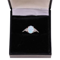 Silver opal and cubic zirconia cluster ring, stamped 925, boxed