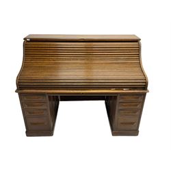 Cutler - early 20th century American oak tambour roll-top desk, the twin pedestals fitted with four graduating drawers
