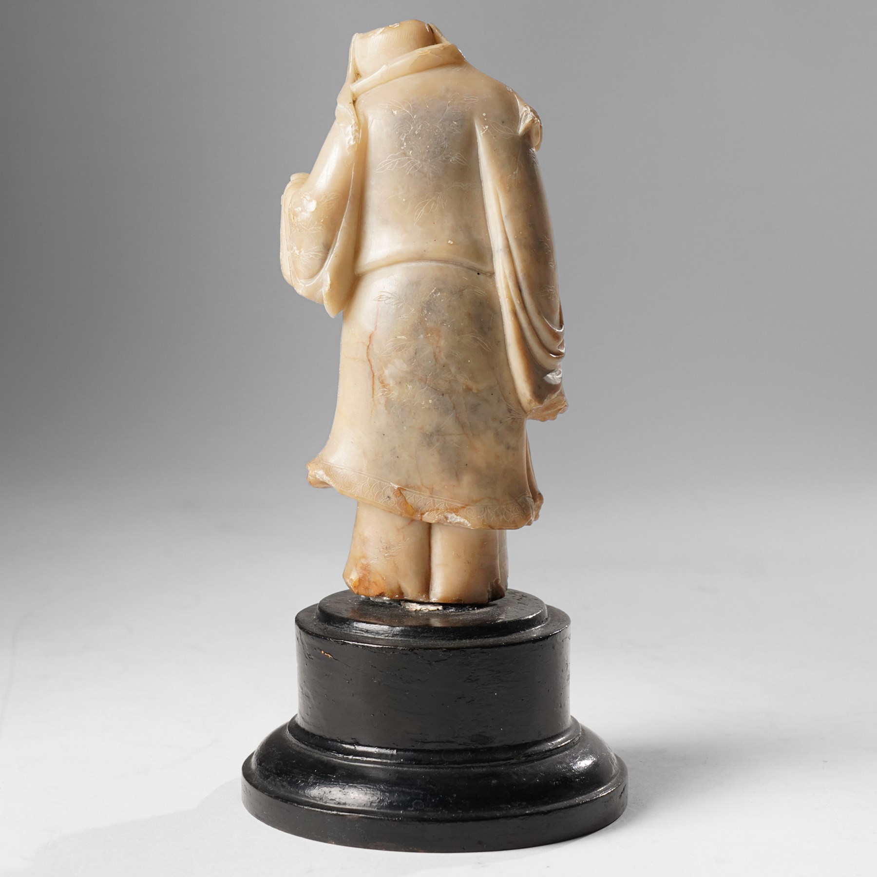 Soapstone carving of an immortal, possibly Zhongli Quan, on ebonised wooden base, including base H22cm