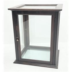 An early 20th century oak glazed counter top display case, with six glazed panels and hinged door, H60.5cm L50cm D42cm. 