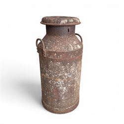 19th century milk churn with weathered patina along with aluminium watering can