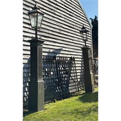 Impressive pair of 19th century cast iron gate piers by Coalbrookdale, each with a later l...