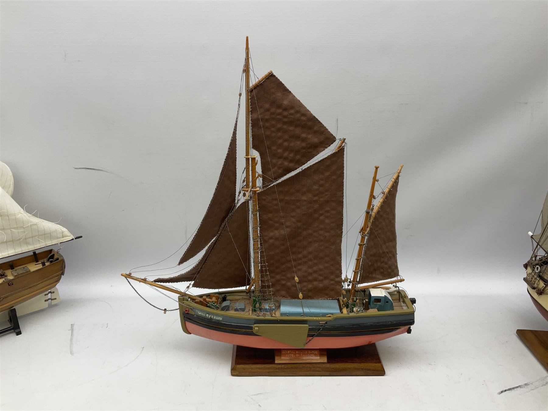 Eight model ships or boats including fishing boat with fish, nets and buoyancy aid, two mast sailing ship complete with cannons, two mast yacht with detailed rigging and life boat etc, the largest L72cm, H60cm
