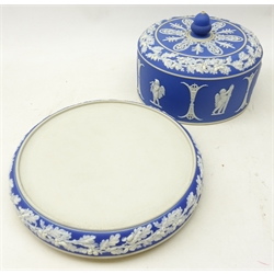  Victorian Brownhill Pottery Co. Cheese Dish and Cover, relief decorated with Neo-Classical figures on a buff ground, impressed marks, another decorated in Wedgwood Blue Jasper style, both with acorn finials, H23cm max  
